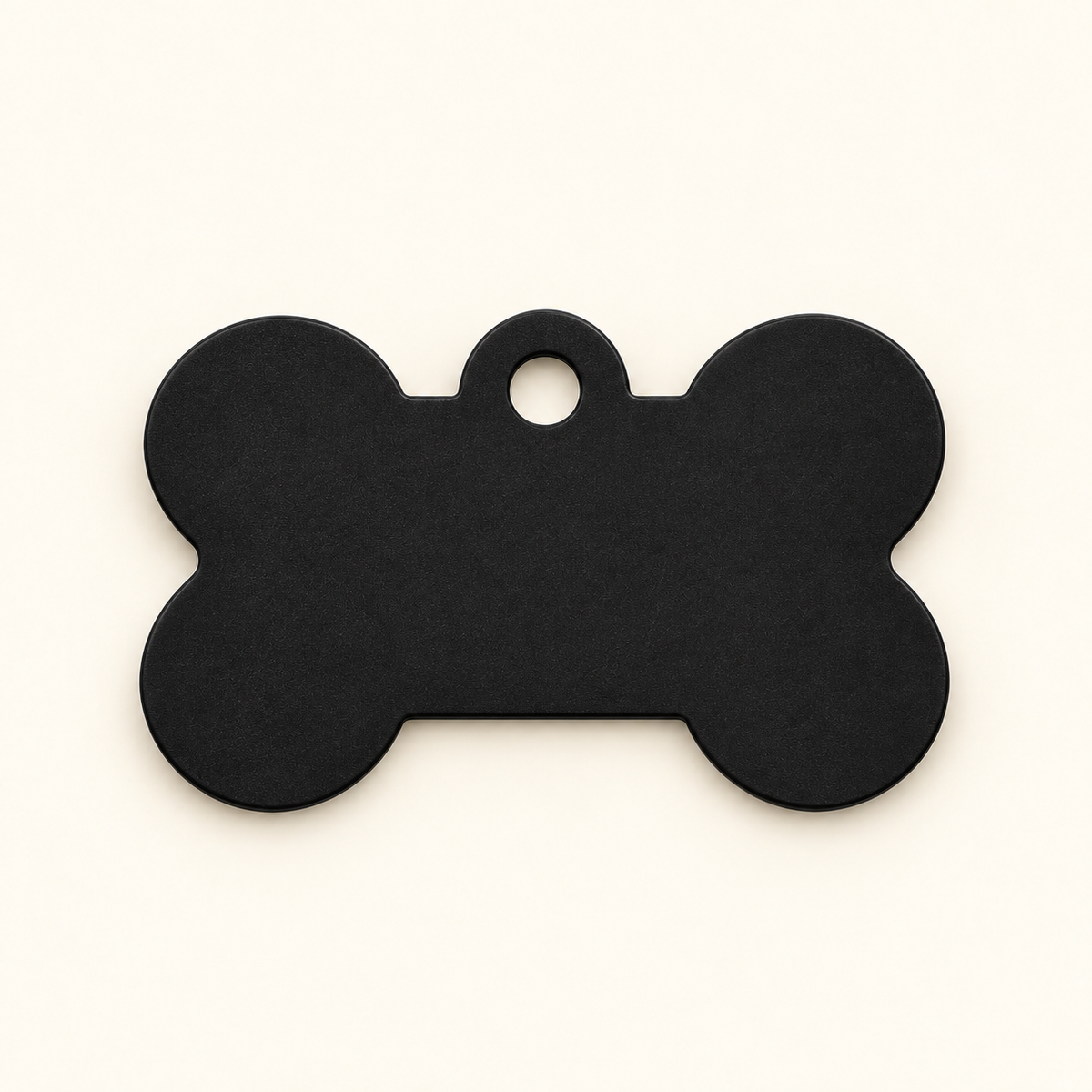 Black bone-shaped pet ID tag, blank before engraving