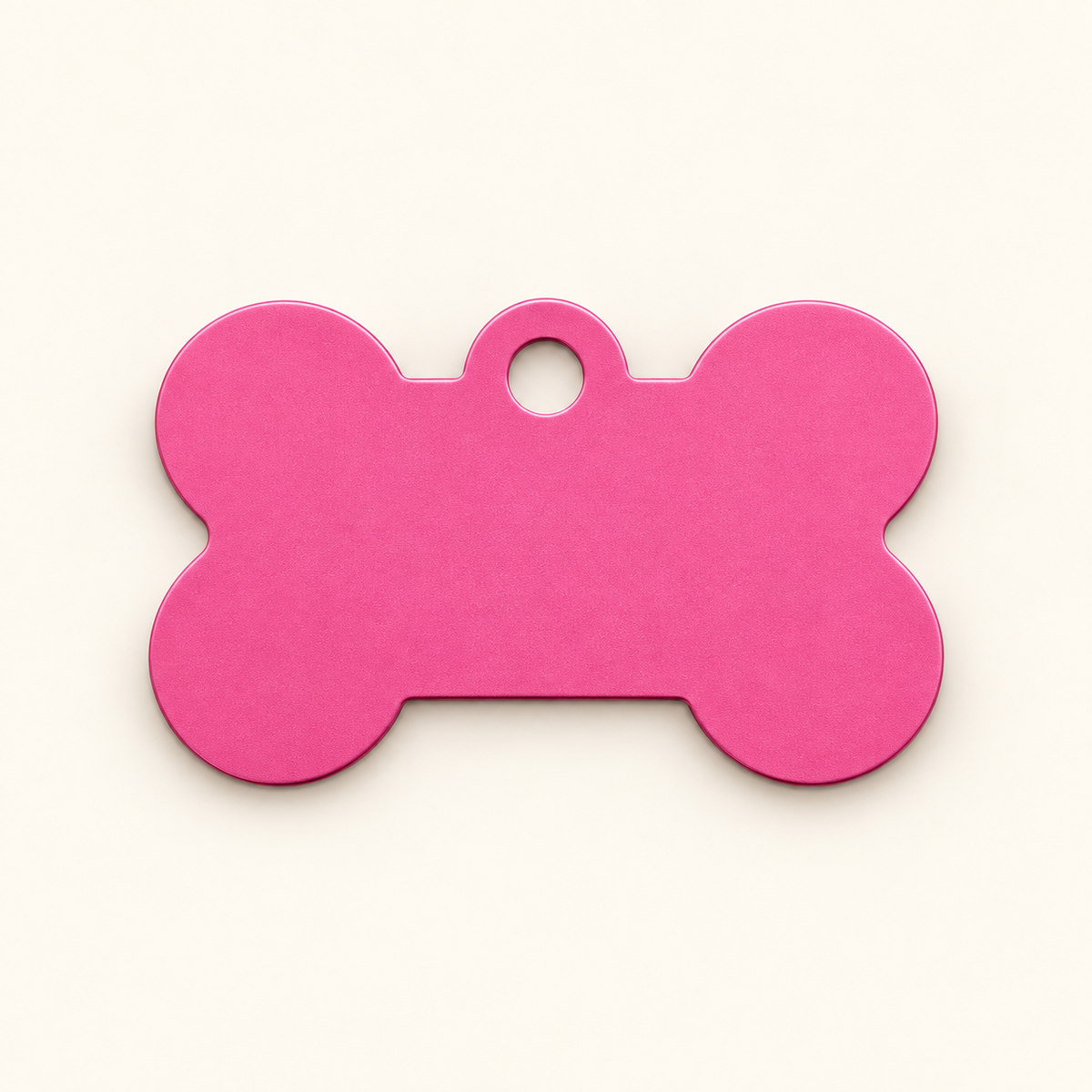 Pink bone-shaped pet ID tag, blank before engraving