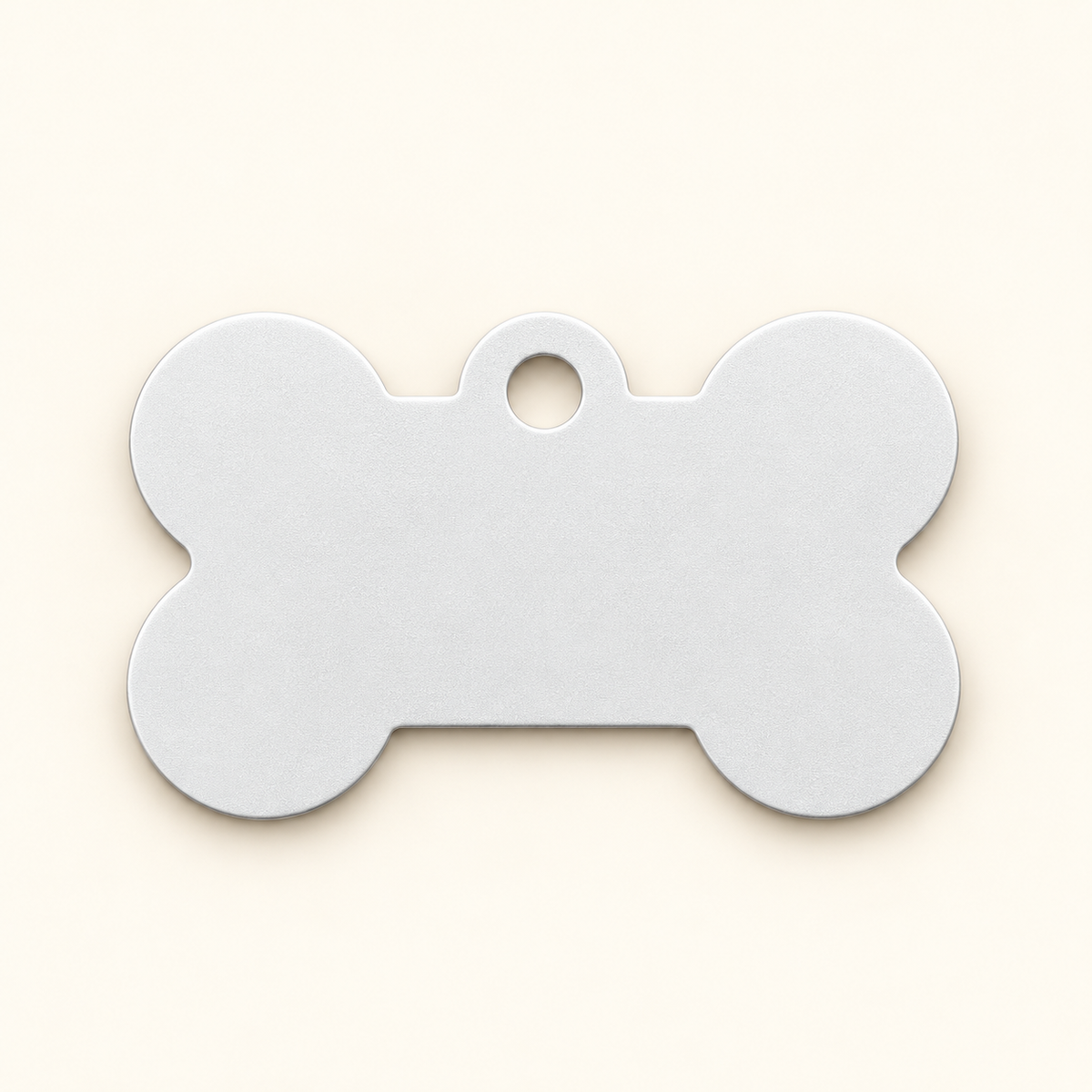 White bone-shaped pet ID tag, blank before engraving